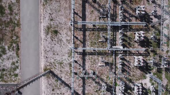 Aerial view of electrical power transformer in high voltage substation. alt