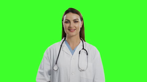 Caucasian female doctor on green screen background alt