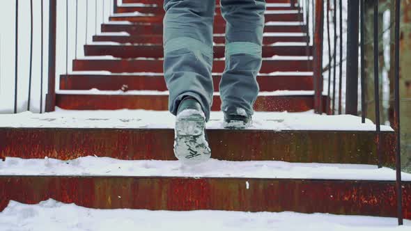 A Worker in Gray Pants with a Light Horizontal Stripe alt