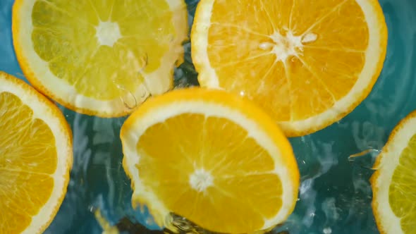 Fresh Orange Fruit and Water Splash