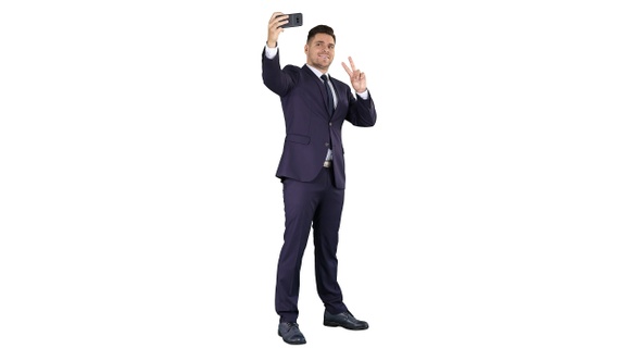 Business man taking selfie on white background. alt