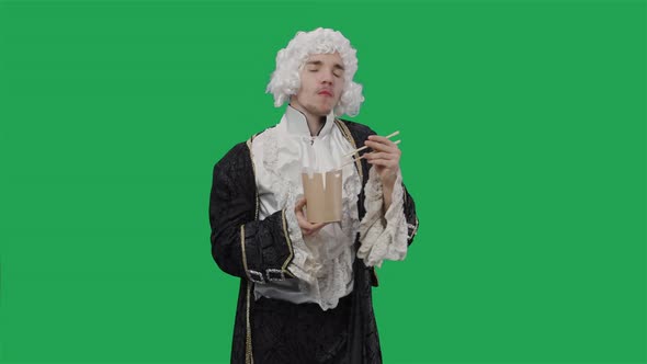 Portrait of Courtier Gentleman in Black Vintage Suit and Wig Enjoying Chinese Noodles Using alt