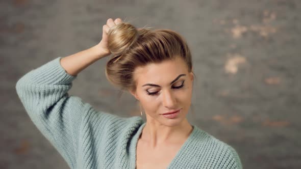 Beautiful Caucasian Blonde Woman Showing Off Long Hair alt