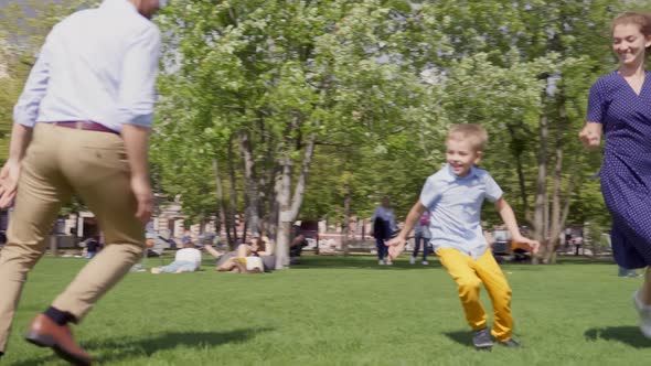 Happy Mother Father and Little Cute Son Having Fun Together alt