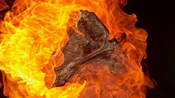 Super Slow Motion Footage of Grilled Tbone Meat in Fire at 1000Fps alt