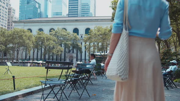 Young girl walking in park alt