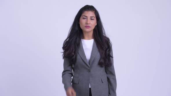 Young Happy Persian Businesswoman Thinking and Looking Up alt