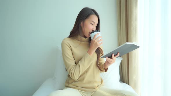 Young asian woman with coffee cup