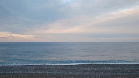 calm sea and beach on a cloudy day