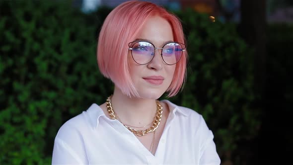 Portrait of Young Caucasian Girl with Pink Hair alt