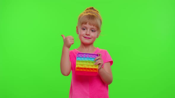 Child Girl Playing Squishy Silicone Bubbles Sensory Toy Simple Dimple Pop It Game Chroma Key alt