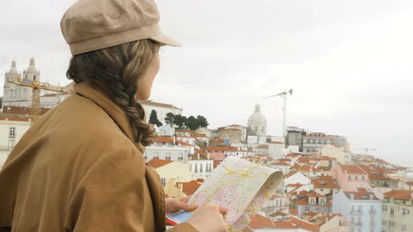 Lady Stands on Observation Deck and Looks for Destination alt