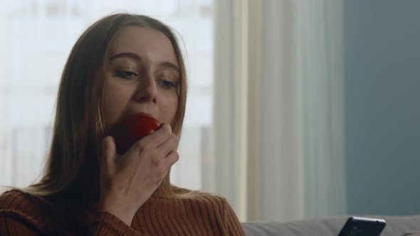 Pretty Girl Bites Red Apple