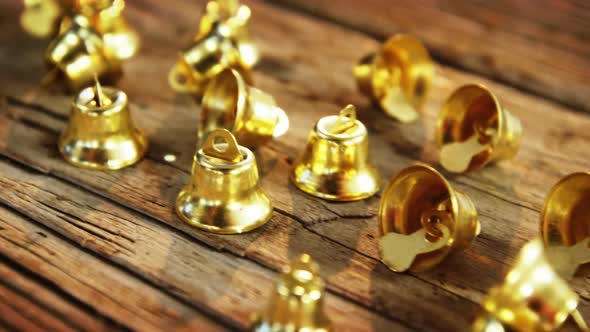 Small bells and star shape ornament on a plank alt