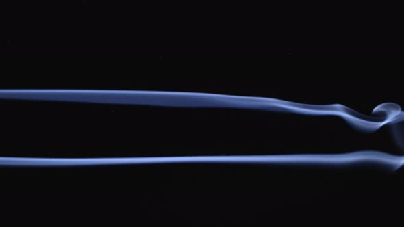 Two Jets of White Smoke Flow Into Clouds alt