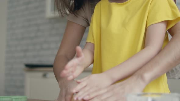 Mom and Daughter Prepare Dough Together