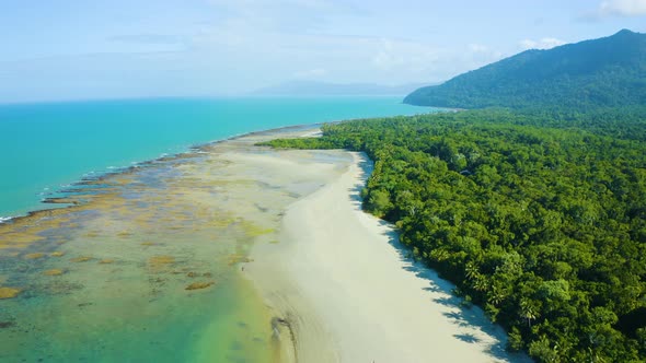 Aerial, gorgeous sand beach and rain forest at Cape Tribulation in Queensland, Australia