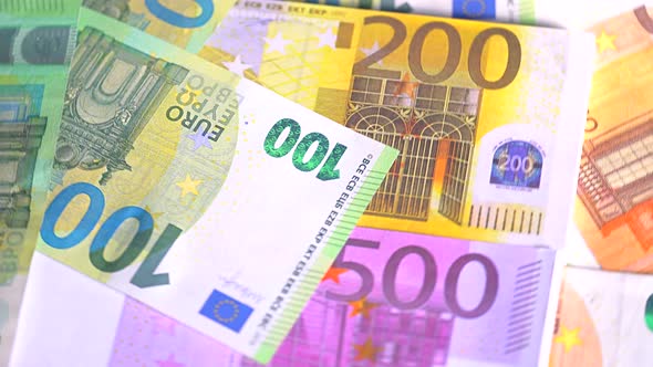 Euro currency banknotes background. European paper money backdrop with 100, 200 and 500 euros bills. alt