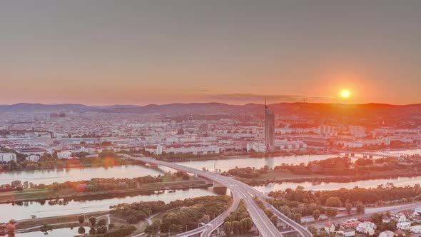 Aerial Panoramic View of Sunset Over Vienna City with Skyscrapers Historic Buildings and a Riverside alt