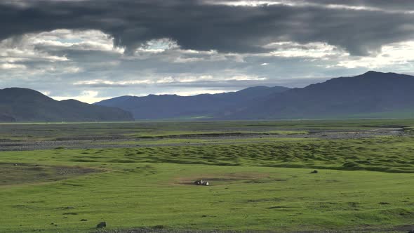Asian Yurts in Green Plain Beside The Treeless Hill alt