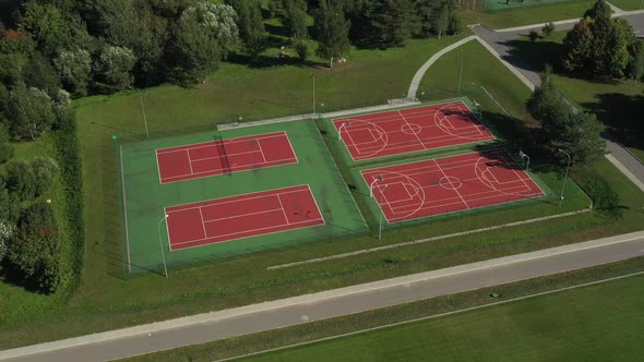 View From the Height of the Empty Tennis Courts in the Daytime in Summer
