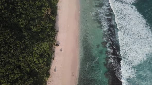 Aerial View of Tropical Beach with Azure Blue Water and Foaming Ocean Waves alt