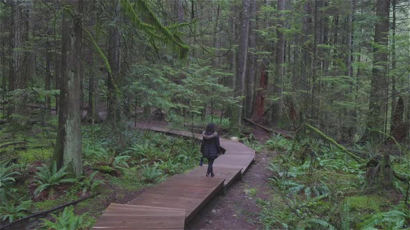 Girl Walking in the Canadian Rain Forest alt