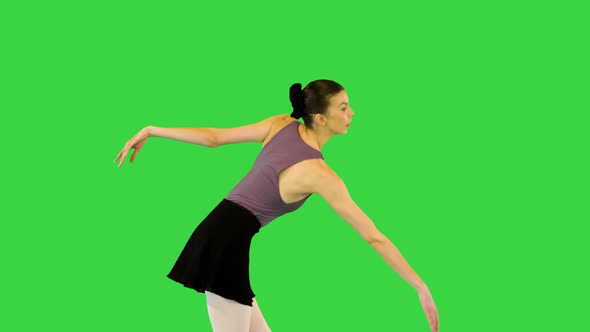 Young Ballerina Walks Demipointe Waving Arms on a Green Screen Chroma Key alt
