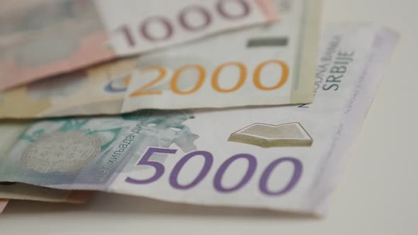 Slow tilt on different denominations of dinar shallow DOF  4K 2160p 30fps UltraHD  footage - Mixed S alt