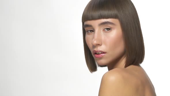 Sensual Woman Posing on White Background alt