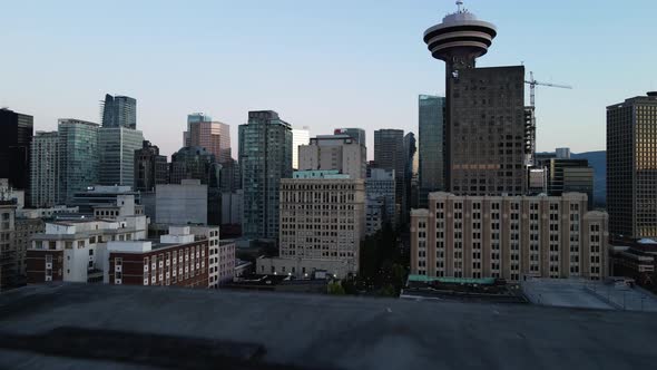 aerial drone footage of downtown Vancouver buildings, gastown, early sunrise, morning urban scrapers alt