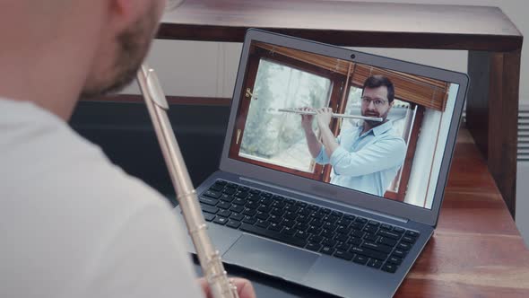 Music Teacher Train Online Lessons on Playing a Wind Instrument on a Flute alt