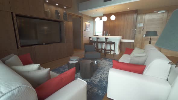 A living room of a luxury hotel room at a tropical island resort. alt