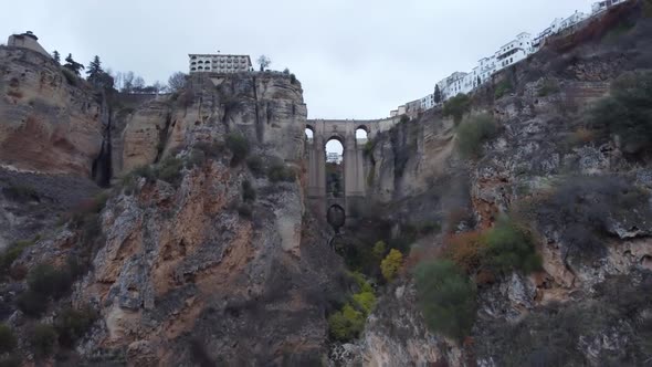 Aerial: New bridge that joins Ronda Spain spans deep vertical gorge alt