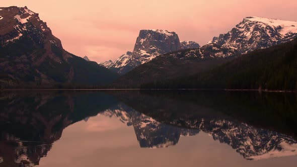 Static view of mountain reflection in lake on ominous day alt