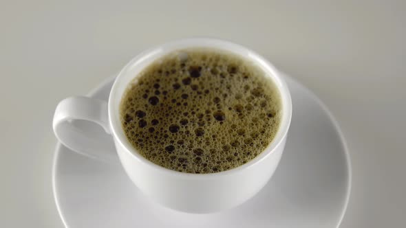 Coffee Cup Rotation 360 Degrees on White Background Espresso Close Up