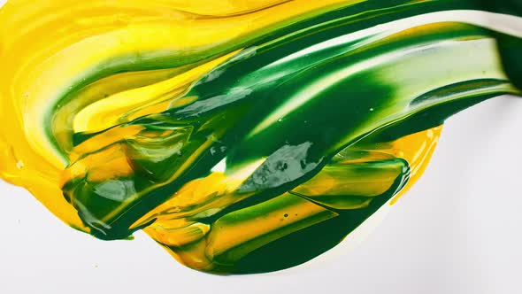 Artist Mixing Ingredients Green and Yellow Watercolor Using Palette Knife and Pigments on White alt