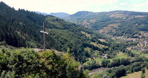 Aries River At The Valley Of Apuseni Mountains With A View Of A Small Village In Romania. aerial alt