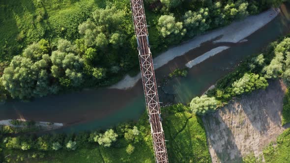 Train Moving on Bridge Above a River