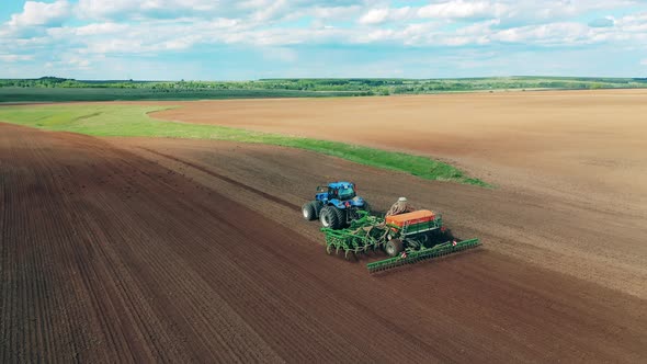Agricultural Combine Is Seeding the Field Ground alt