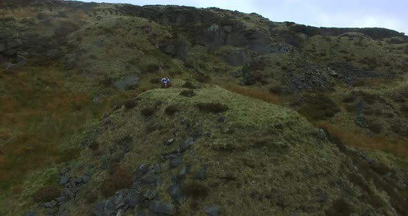 Man running up hill alt