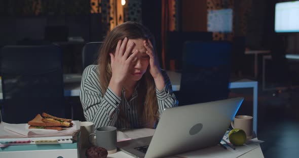 Stressed Businesswoman Using Her Laptop While Having Problem. Overworked Girl Employee Working alt