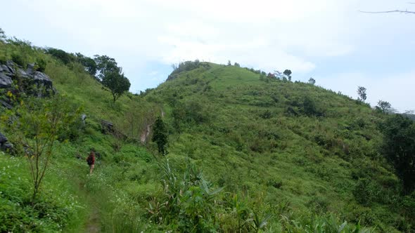 A female traveler hiking at a beautiful mountains