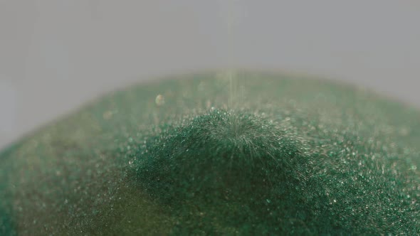 Closeup of the Crumbling Green Sand of the Sand Clock