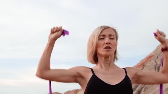 Woman working out on lifeless dried locality