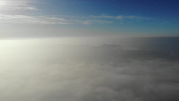 Flying over clouds. Video shot by drone in early morning.