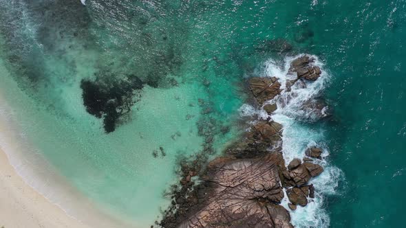 Aerial view of rocky peninsula and coastline in Praslin, Seychelles