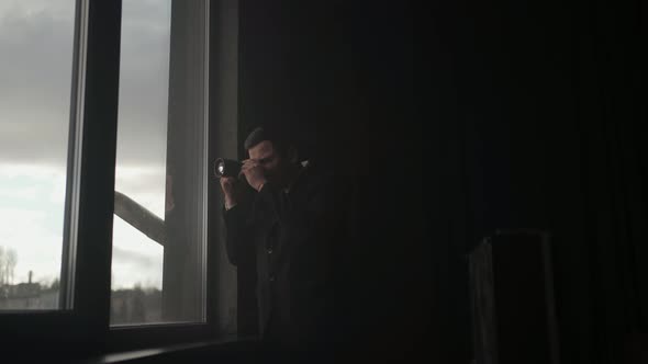 Special secret agent in dark suit is take photos