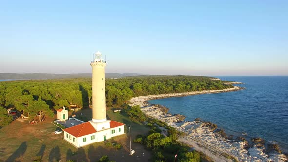 Flying over people visiting a lighthouse, Croatia alt