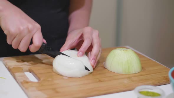 Chopping Onions on a Cutting Board